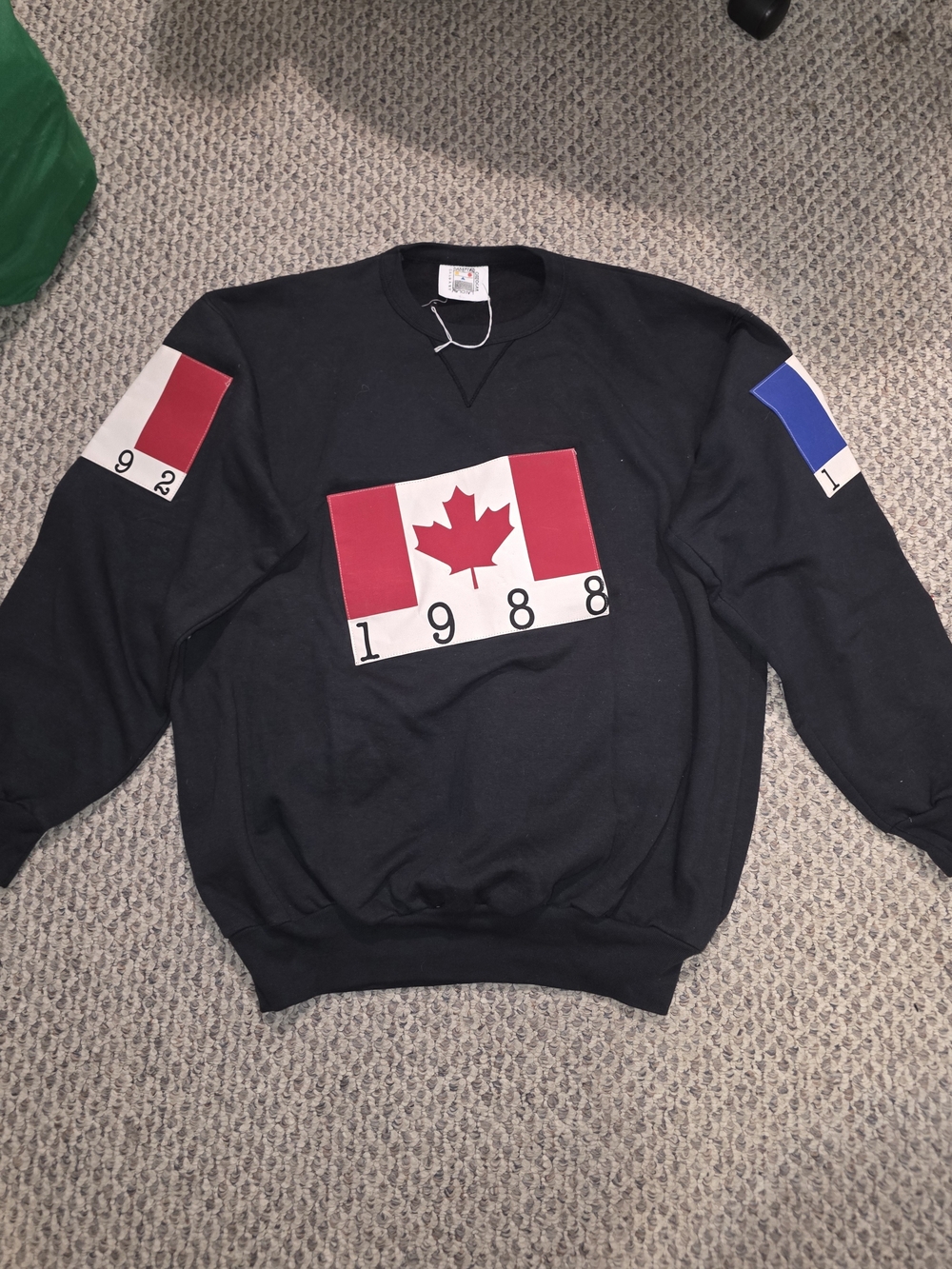 Black Crewneck Sweatshirt with Red Canada Flag Graphic